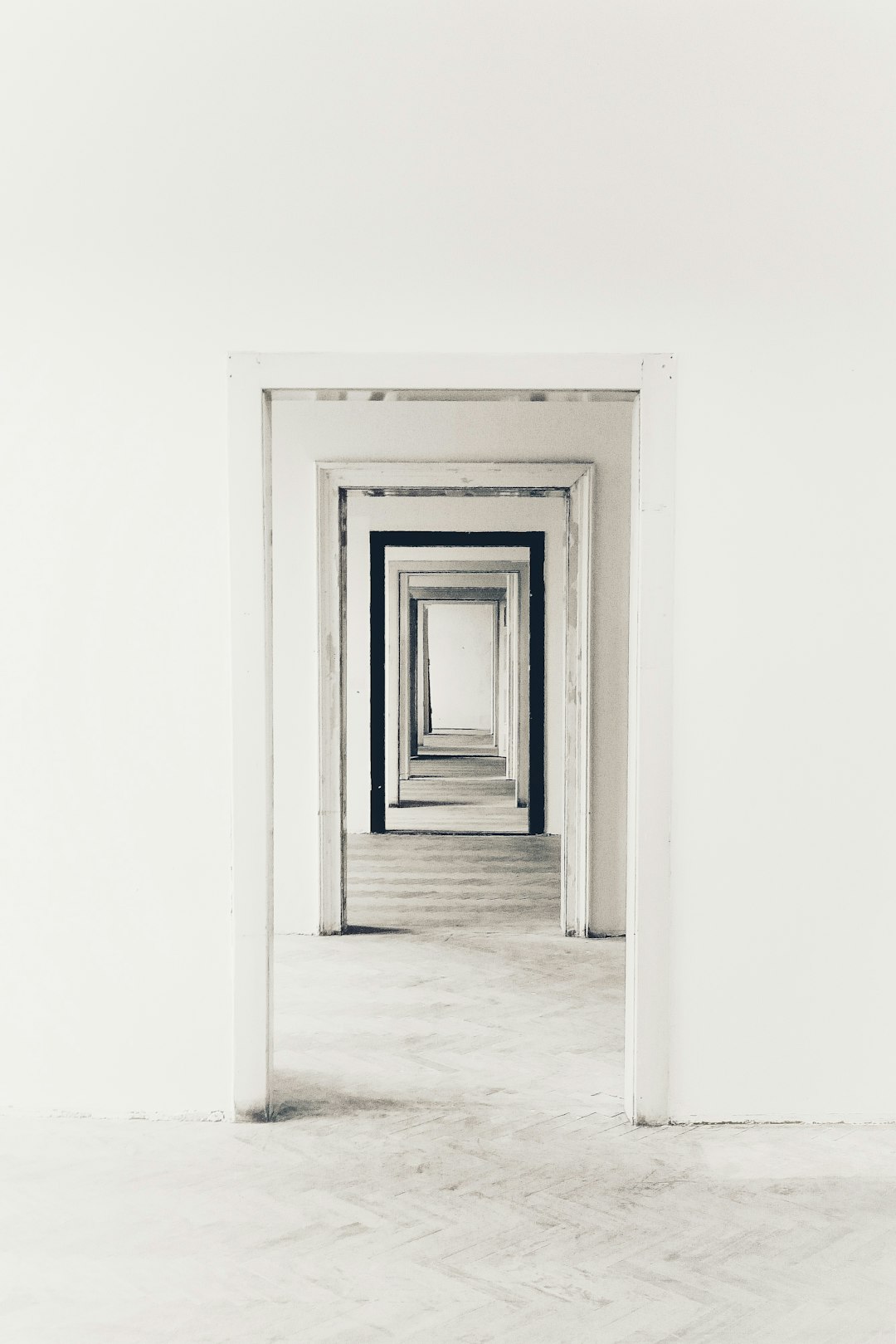 A white room with three doorways, each leading to different rooms, creates an optical illusion of depth and perspective. The doors have thin black frames that highlight their presence in the scene. This is a simple yet powerful visual metaphor for choice or Buddha’s five muddy points, set against a clean background to emphasize its impact on the viewer’s mental state.