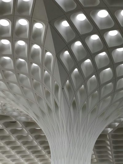 extreme close up detail of the ceiling at Mumbai airport, Indian architecture, parametric design, architectural photography, building facade made in the style of white bad edges and subtle lighting in interior space, light grey metal structure with patterned concrete tiles