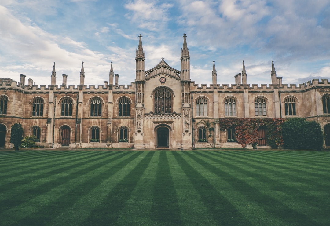 A wide shot of the front lawn at IVY School in Cambridge, UK with its gothic architecture and green lawns, captured on a Canon EOS R5 mirrorless camera in the style of photographer [Alex Strohl](https://goo.gl/search?artist%20Alex%20Strohl). –ar 128:87