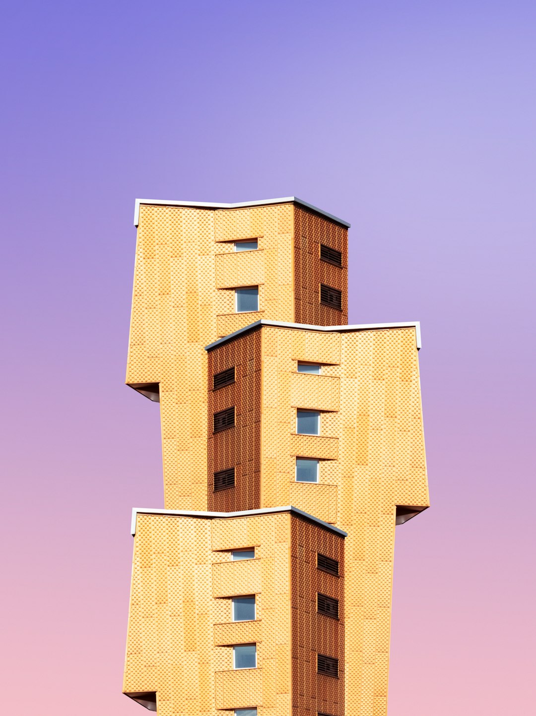 A photograph of an architecture building made out only with beige bricks, stacked in the shape of three modern apartment buildings stacked on top of each other, isolated against a gradient purple sky background, taken from eye-level perspective, architectural photography in the style of hyperrealistic, high resolution. –ar 95:128