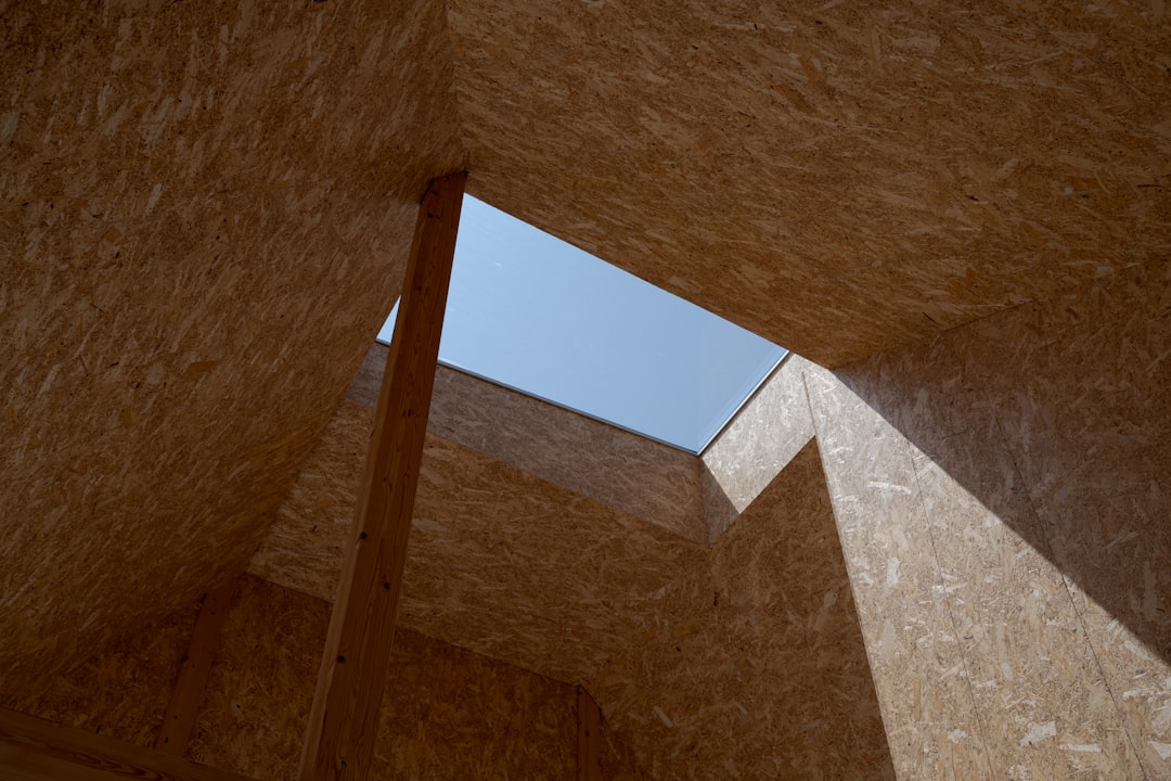 osb wall with skylight, roof, architecture photography in the style of [Anish Kapoor](https://goo.gl/search?artist%20Anish%20Kapoor) and [Iwan Baan](https://goo.gl/search?artist%20Iwan%20Baan)