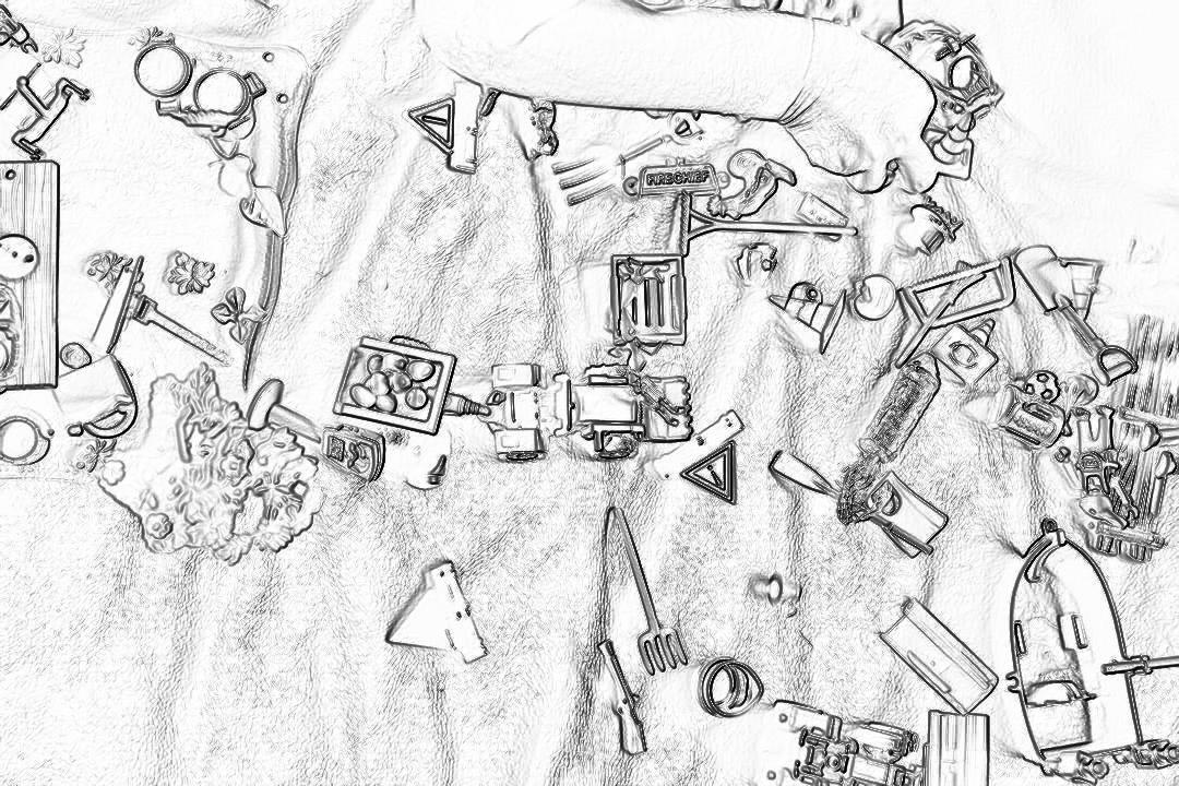 A simple black and white line drawing of the top view of various items scattered on an open table, such as tools for crafting, building blocks, toys or game pieces. The background is plain with no details to emphasize that all these objects were placed together at one time in front of me when I was coloring. This scene creates a sense of anticipation about what kind of world will be created in the style of playing around them. It also emphasizes creativity.