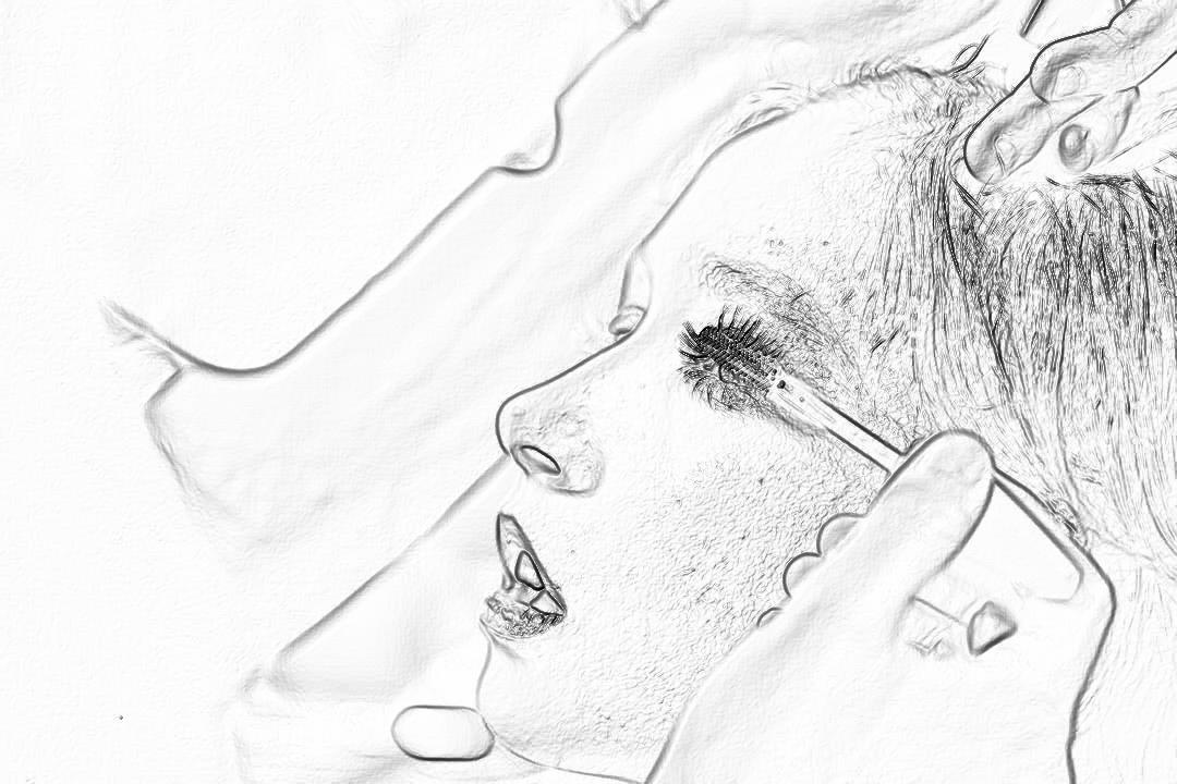 Black and white pencil sketch storyboard of a close up profile view of a man lying on his back, holding an iPhone in one hand and tears falling from his eyes with long eyelashes, on the bed, from the side. White background. No color. The sketch is done in the style of a storyboard artist.