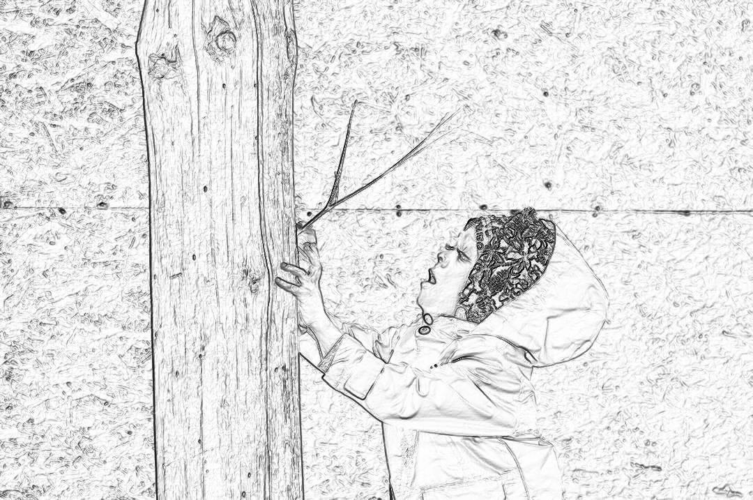 Black and white storyboard sketch of young child trying to reach the top, wooden post on wall with long pole