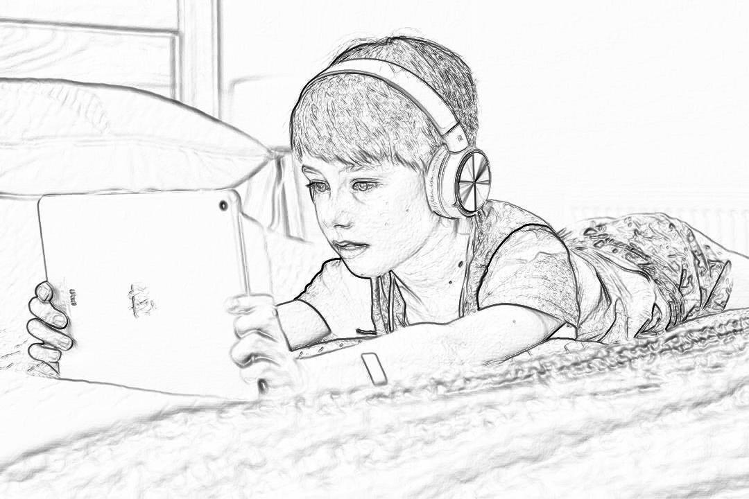 Black and white line drawing, pencil sketch of a young boy lying on his back in a bed wearing headphones looking at an iPad with the screen facing towards him. The background is blurred and indistinct. He has short hair and freckles. A carpeted floor can be seen underfoot. High resolution. A sketch in the style of drawings for kids coloring books.