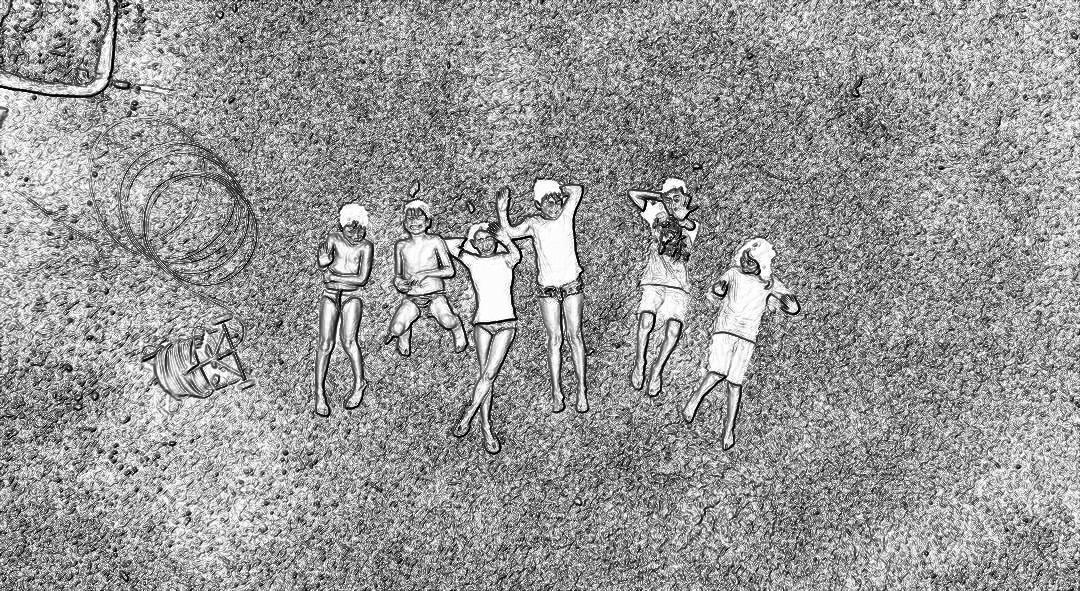 A black and white pencil drawing of young people on the beach, top view, drone shot, drawn in the style of studio ghibbli, drawn in the style of anime.