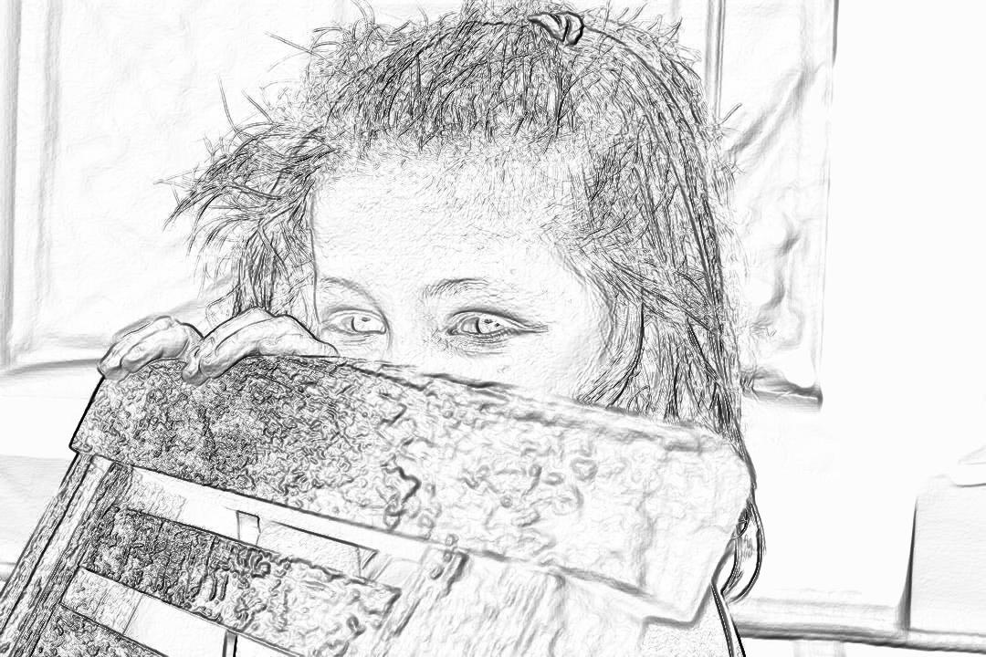 Black and white pencil sketch of an adorable little girl with messy hair hiding behind her birthday present. The sketch shows a zoomed out view of the scene.