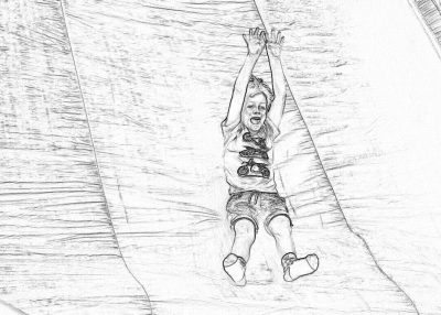 Black and white storyboard line drawing of a young boy sliding down an inflatable slide, his face lit up with joy as he smiles wide while falling to the ground. He is wearing shorts and a t-shirt, holding both hands above his head for balance. The background shows a large plastic fabric that creates an air tunnel. The simple black lines on a clear white background depict the scene in the sketchy style of simple design, with no details or shadows and no color.