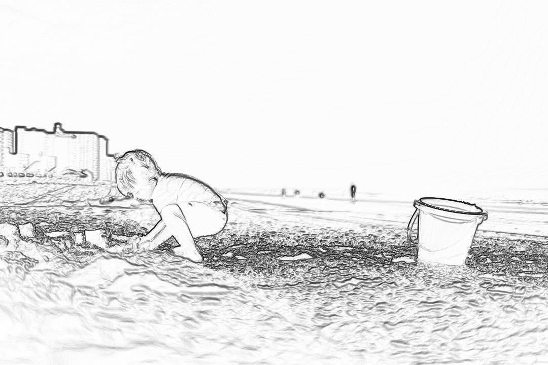 Black and white storyboard line drawing of a child playing in the sand on the seafront at Southend, there is an empty bucket next to them. The drawing is in the style of appeal.