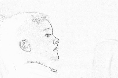 A simple pencil sketch of an African American boy with short hair, looking sideways at the camera. The background is white and has no details or shadows to highlight his profile against it. He's wearing lightcolored that complemented by the soft lighting from behind him. His expression reflects focus as he gazes forward. This drawing emphasizes her side face in detail. It creates depth through subtle shading around facial features and edges, creating a sense of threedimensionality without any text on paper.