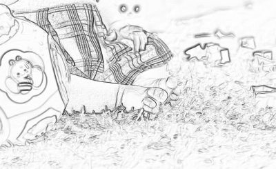 black and white line art illustration of the side view close up shot from below, man wearing plaid shorts laying on his back in an open field playing with children's toys