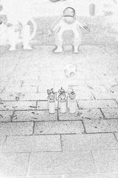 pencil drawing of three small, plastic toy figures on the sidewalk in front of an old building. The figure is made out to look like they could be aliens or space ships or alien creatures. They stand next to each other and face away from camera. There's no background, just flat stone floor with faintly visible lines representing cobblestones. It looks very simple. The pencil strokes should be bold but light. The overall feel would be whimsical and childlike. No shading, just pure black ink.