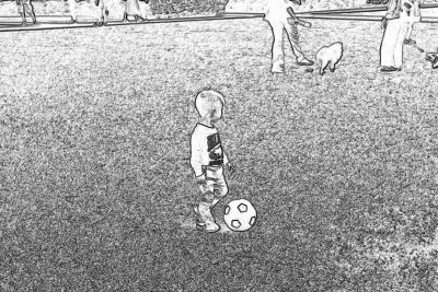 A little boy playing soccer on the field, with his family watching from afar. Black and white sketch, storyboard style. The child is wearing an oversized jersey that was taken off by one of them to play football in it. A dog stands next to him waiting for its ball. On both sides there were other people walking around or sitting down on their knees, enjoying the game. They all looked happy as they played together in the style of one of them.