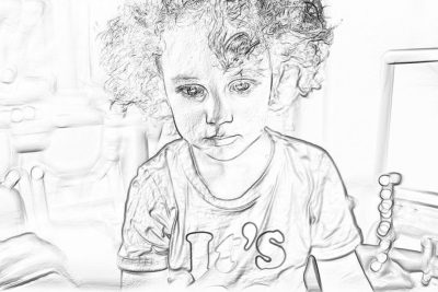 A cute little boy with curly hair, wearing a "gallery" t-shirt and holding toys in his hands sits at the table. The background is white, creating an atmosphere of a black drawing. Black line drawings on paper, sketching, coloring pages, simple lines, soft tones, and soft lighting. The drawing appears to be in the style of a simple black line drawing.