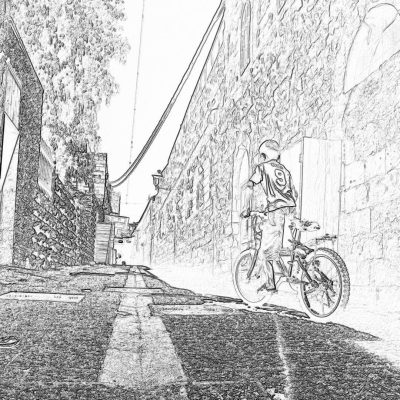 A black and white storyboard sketch of an extreme sports biker wearing helmet, riding his bike on the street in Alaior town center with old stone walls. The scene is captured from behind as he drives by, creating dynamic movement. He's dressed casually but stylishly for sport. No text or graphics should be visible other than some subtle details like lines to show motion. It’s an urban setting with trees and buildings, and it feels casual yet vibrant. Sketch style, pencil drawing. Black & White.