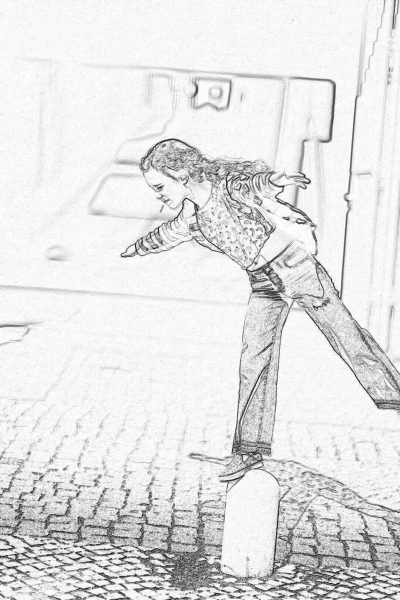 A black and white coloring page drawing of Michael Jackson on the edge of a street corner, leaning over to pick up something from his shoebox under him. He is wearing jeans with a jacket. The background shows part of a street wall in Europe in the style of St femme Wallmark.