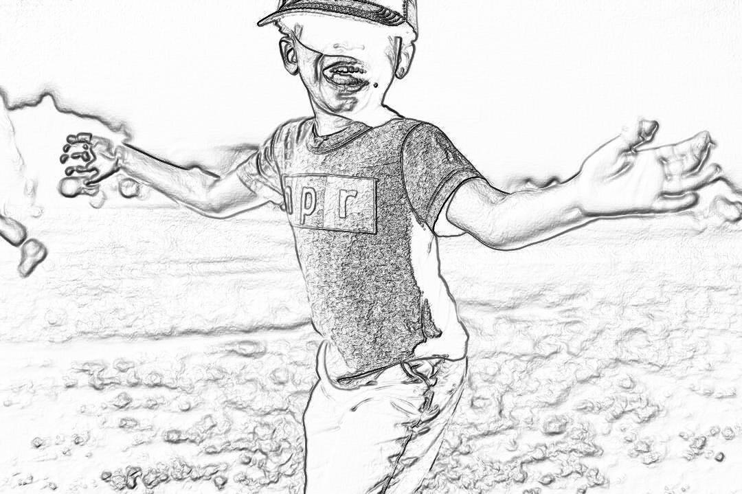 Black and white pencil sketch storyboard of a young boy wearing a baseball cap playing at the beach, his hands outstretched with sand flying up around him, he is smiling with his mouth open showing his teeth, a wide shot full body view. The sketch is done in the style of pencil drawings.