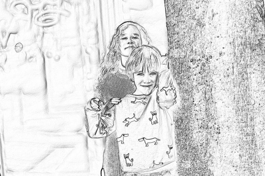 Black and white line drawing, in the style of children’s graffiti, of two girls holding hairbrushes smiling at the camera, with a simple background, carved on a stone wall. The little girl is wearing dog-patterned pajamas with long sleeves and pants. High resolution.