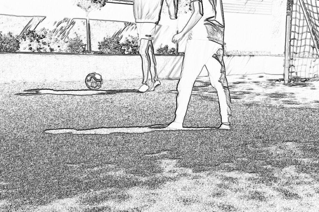 Black and white storyboard drawing of two people playing soccer on the lawn, with only their legs visible in closeup. The goal is seen in the distance. It is sunny outside. The drawing is in the style of an anonymous artist.