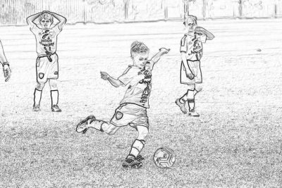 Black and white line art sketch of kids playing soccer, a boy kicking a ball with his right leg while other players stand behind him on the field in the background. The drawing is simple, with clear lines and no shading or color to highlight details. It captures an action shot as if captured in the style of a camera. A small cartoon logo "j conferences" appears at the top left corner. No text appears inside the box.