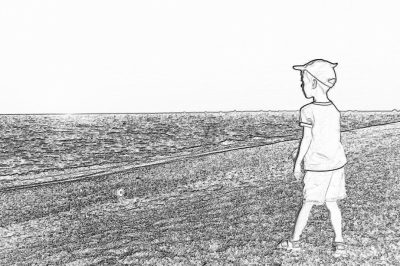 Black and white storyboard line rough sketch, simple pencil drawing of a boy wearing a baseball cap standing on the grassy shore by the sea looking at the horizon with his fishing rod in hand. He has some small bubbles floating around him. The background features an endless ocean with gentle waves in a simple line style with low details and no shading.