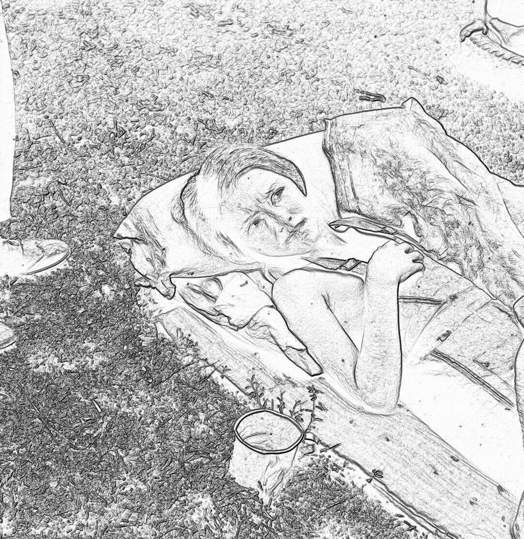 A simple black and white line art sketch shows an adult sleeping on the ground with his head resting in one hand, lying next to some camping equipment, while eating ice cream from inside a plastic cup. The background is a blurred grassy area. There is no shading or color washes. The image has low detail for easy coloring in the style of children. In full view.