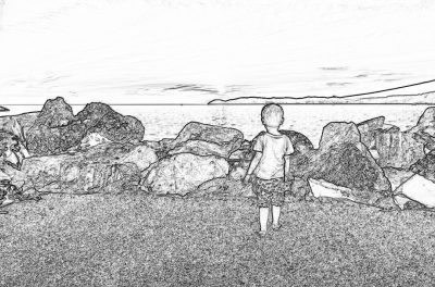 Black and white storyboard line drawing of A little boy standing in front of rocks on the beach, seen from behind, watching out to sea. The scene is captured in high resolution with the style of pen and ink sketch.