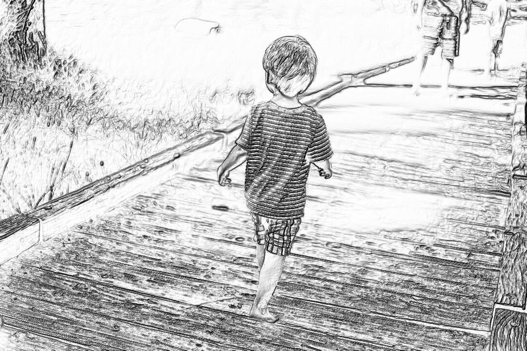 Black and white pencil sketch of an adorable little boy walking on the boardwalk at a beach, back view, drawn in the style of a children’s book.