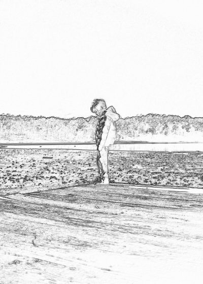 a little boy standing on the beach, holding his shirt up to show it off. The view is from behind him and he's looking at me. He has short hair. Black ink drawing on white background.