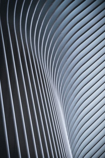 Abstract photo of curved lines in the interior of New York's "The coming out" building, with high resolution and very detailed volumetric lighting and sharp focus, in the professional photography style shot with a canon r6 mark II camera using Fujifilm Velvia film. --ar 85:128