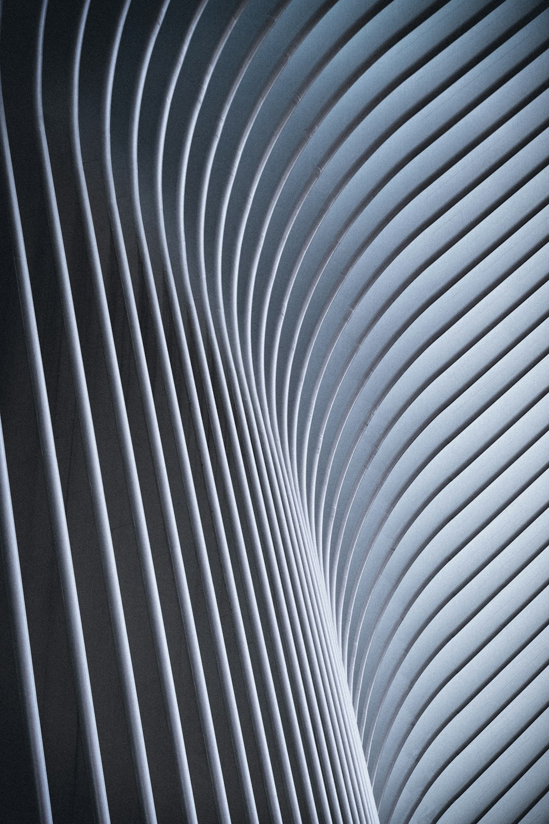 Abstract photo of curved lines in the interior of New York’s “The coming out” building, with high resolution and very detailed volumetric lighting and sharp focus, in the professional photography style shot with a canon r6 mark II camera using Fujifilm Velvia film. –ar 85:128