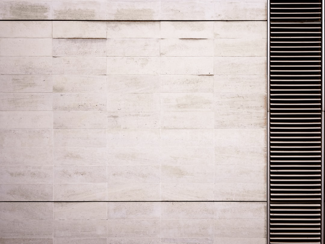 white travertine wall with horizontal slats on the right side, minimalistic, architectural photography, –ar 4:3