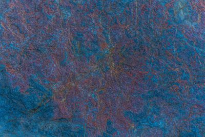 Blue background with dark blue, purple and brown stone patterned surface. Abstract texture for design, print or wallpaper. Texture of natural rock in dark colors. Close up view. High resolution photography --ar 128:85