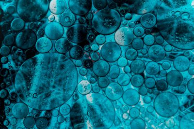 Abstract teal blue bubbles and circles in oil on water, macro photography, high resolution, high detail, closeup, hyper realistic, cinematic --ar 128:85