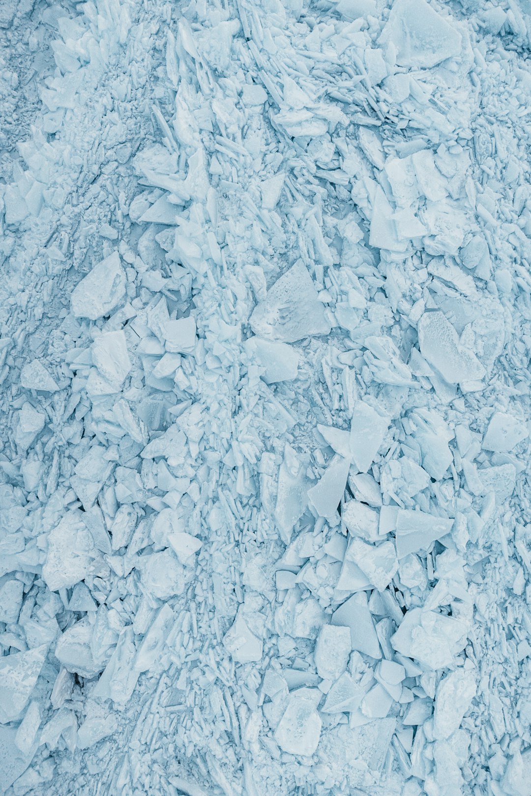 photograph of ice and snow texture, top view, flat lay, light blue color palette –ar 85:128