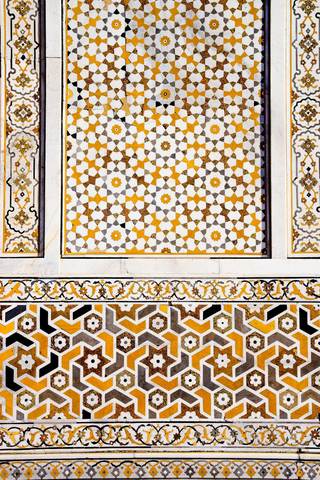 A closeup of the intricate geometric patterns on an Islamic mosaic, showcasing yellow and white hues against a marble stone background. The symmetrical design features traditional Indian motifs such as stars or hearts, adding depth to its appearance. This composition highlights both artistic craftsmanship and cultural significance in Arabic art, in the style of traditional Islamic patterns. –ar 85:128