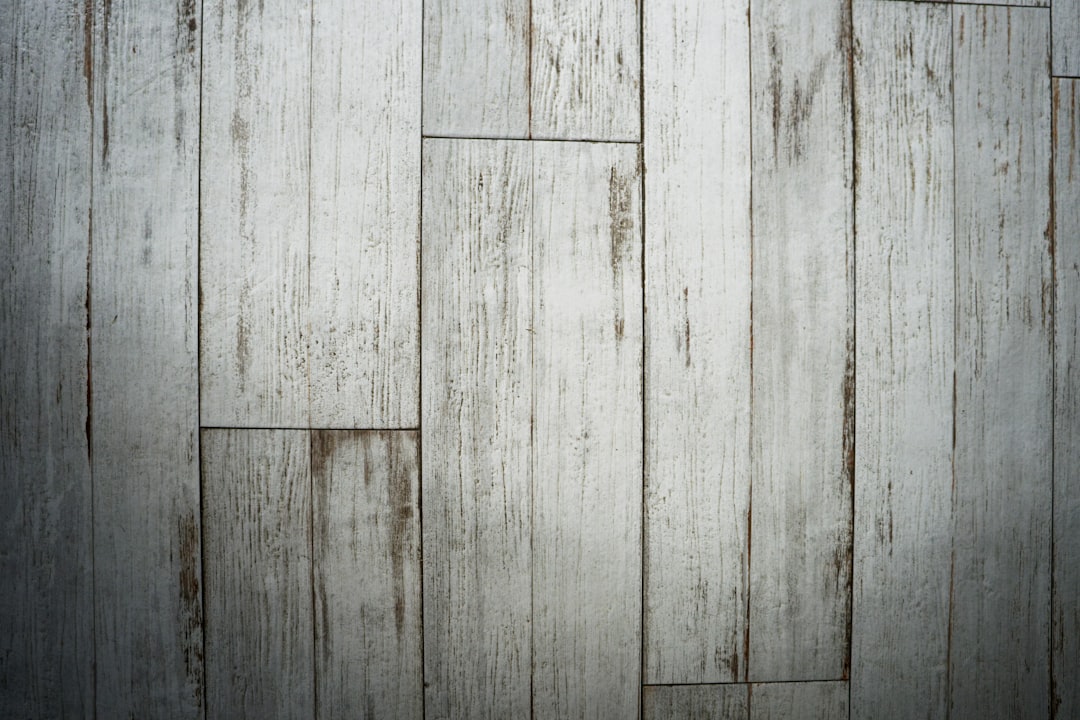 White wooden floor, distressed and weathered style, top view, closeup, texture background, high resolution photography, professional color grading, no contrast, clean sharp focus, soft shadows, hyper realistic –ar 128:85