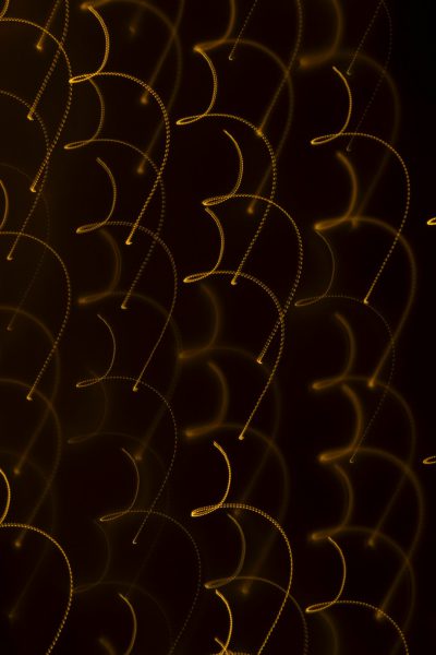 A background of golden lines on black, in the shape of circles and arches, with a dark brown gradient background, light painting, and glowing curves --ar 85:128