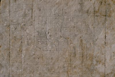 hyperrealistic, dirty and stained beige marble wall texture with a grid of small squares in the style of small squares --ar 128:85