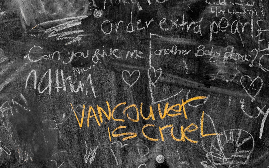 a blackboard covered in hand written graffiti that says ” order extra heart baby please . Can you take me to vancouver? can we stop at the park and pick up some hearts for my girl?” with white chalk, and yellow ink that reads “v Cheng –ar 8:5