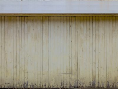 a close up of a wall with white vertical lines on it, light yellow wall with horizontal stripes, white and beige color scheme, industrial style building with a wooden garage door, flat painted, vintage painted, detailed wood grain texture, low resolution, slightly worn --ar 4:3