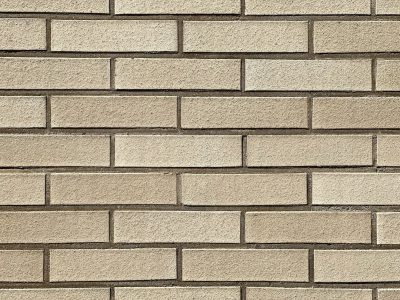 A light beige brick wall with even, uniform blocks creating an elegant and sophisticated background texture. The background is made of rectangular bricks in a straight line pattern, giving it the appearance of traditional masonry or building construction. This design adds depth to any text overlay, making for a classic yet timeless aesthetic. The neutral color tone enhances its appeal as both stylish and professional, suitable for various applications like web backgrounds, graphic designs, etc. --ar 4:3