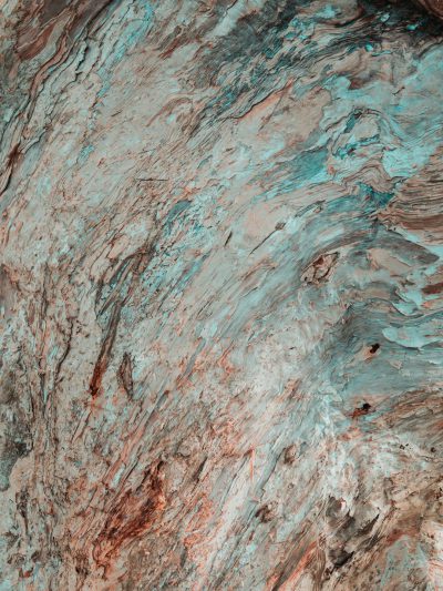 A top-down view of the surface texture of an alien rock, with a teal and brown color palette, in the style of hyper realistic photography. --ar 3:4