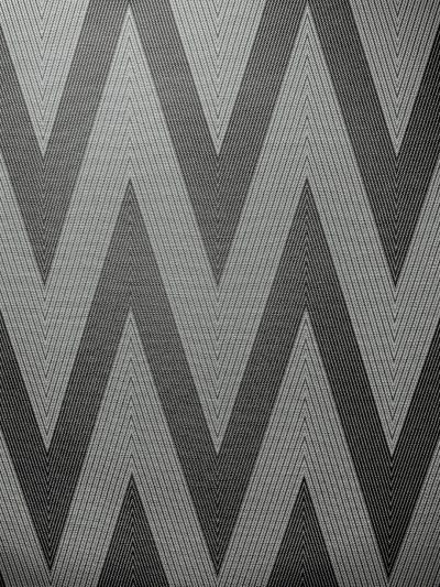 A grey and black zigzag pattern on the wall, in high resolution, high detail, and high quality. --ar 3:4