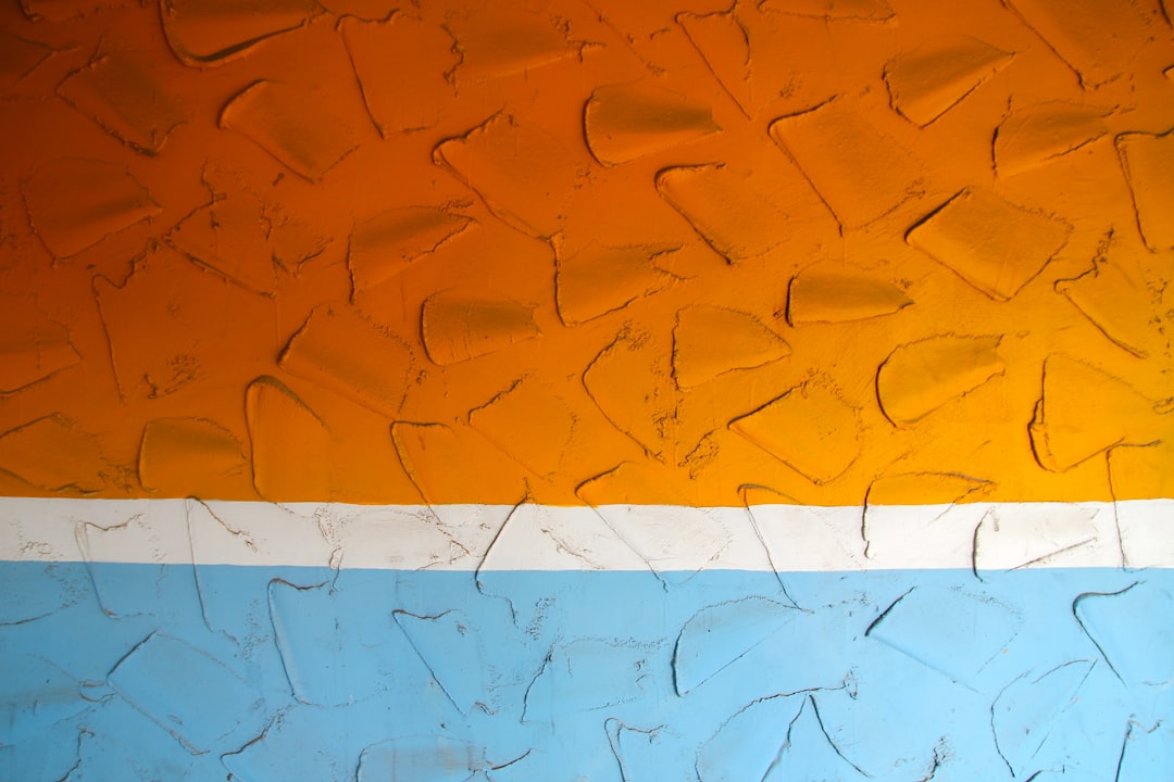 orange and blue color, orange wall with a white line on it, painted texture, detailed –ar 128:85