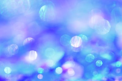 Blurred light blue and purple background with sparkling bubbles, creating an enchanting atmosphere for festive or special events. --ar 128:85