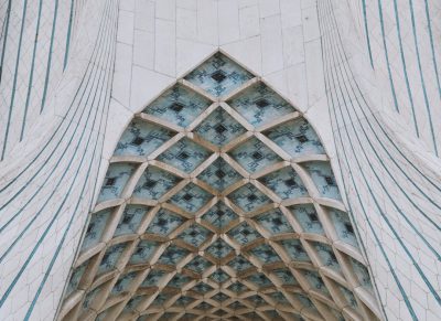 exterior of Azadi tower in Tehran, geometric architecture, symmetrical composition, close up, white and blue color scheme, intricate details, cinematic shot in the style of [Wes Anderson](https://goo.gl/search?artist%20Wes%20Anderson), --ar 128:93