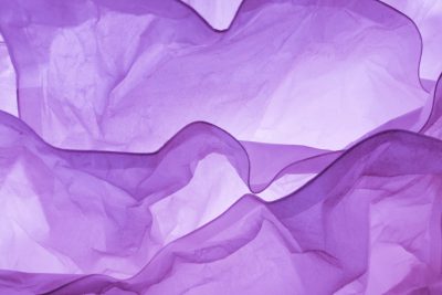 Abstract purple paper background with wavy shapes. The texture of crumpled, transparent and gauzy fabrics creates an elegant visual effect. --ar 128:85