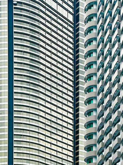 Closeup of the curved facades and balconies on two modern highrise buildings in Hong Kong. The building is made up of large glass windows with white vertical stripes that create an interesting pattern against the green background. This photo was taken during daylight to highlight details such as textures, shapes, colors, reflections, shadows, light rays, and highlights. It has been digitally altered in the style of an octane render. --ar 3:4