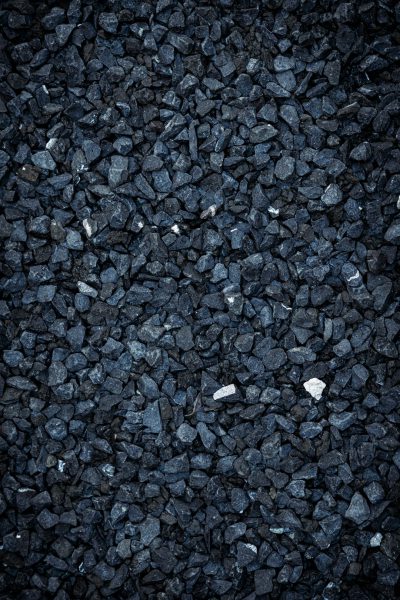 Black gravel background, high resolution, ultra realistic photography --ar 85:128